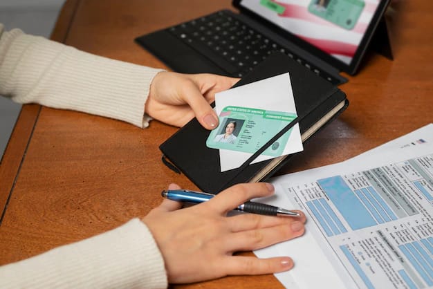 Person holding a black notebook with a green identification card and a white envelope, along with a pen and documents on a table, depicting a scenario involving personal identification and travel documentation.