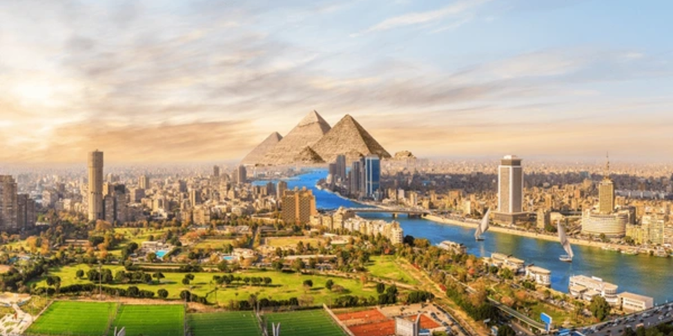 "Cairo skyline with the Nile River and Pyramids in the background – A blend of modern and ancient Egypt."