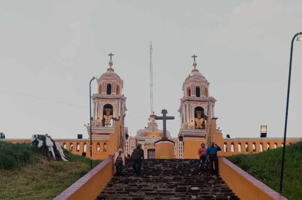 Is mexico a city safe? Stunning view of the Nuestra Señora de los Remedios Church atop ancient pyramid in Puebla, Mexico.