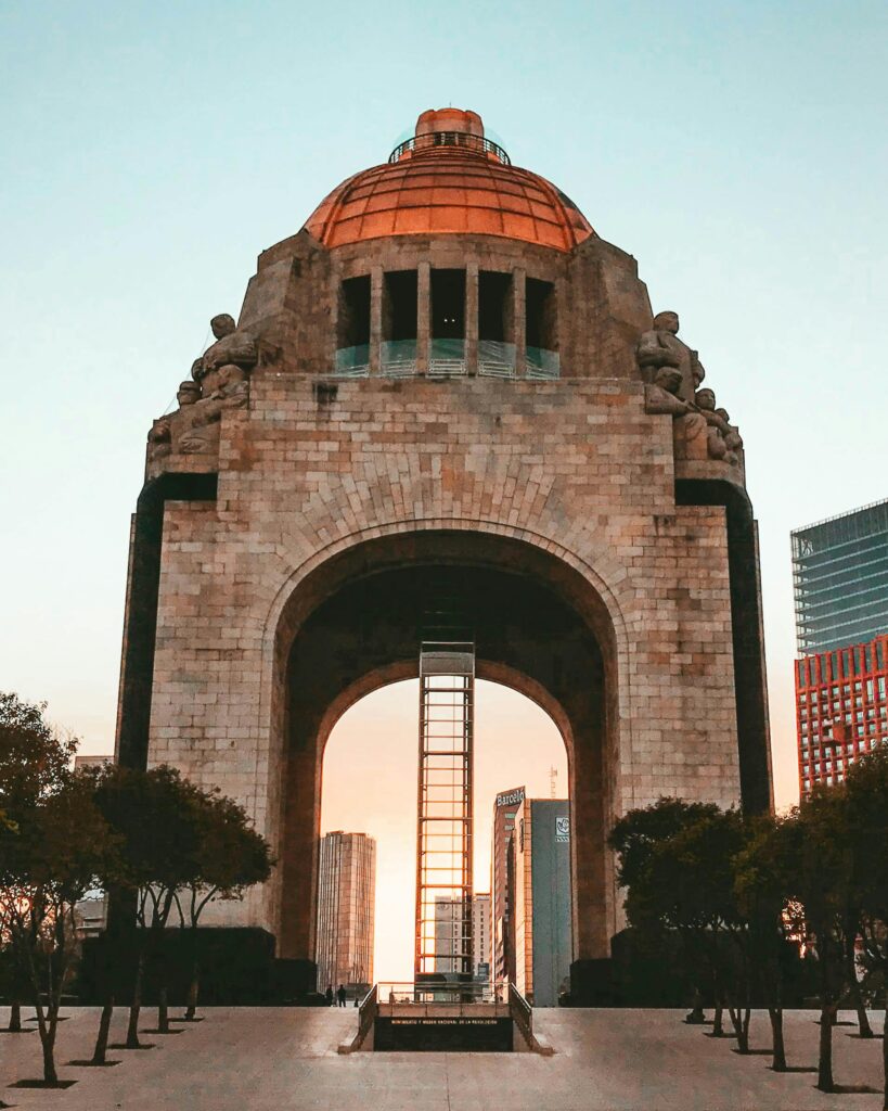 Is mexico a city safe? Stunning view of the Monument to the Revolution in Mexico City, captured at sunrise.