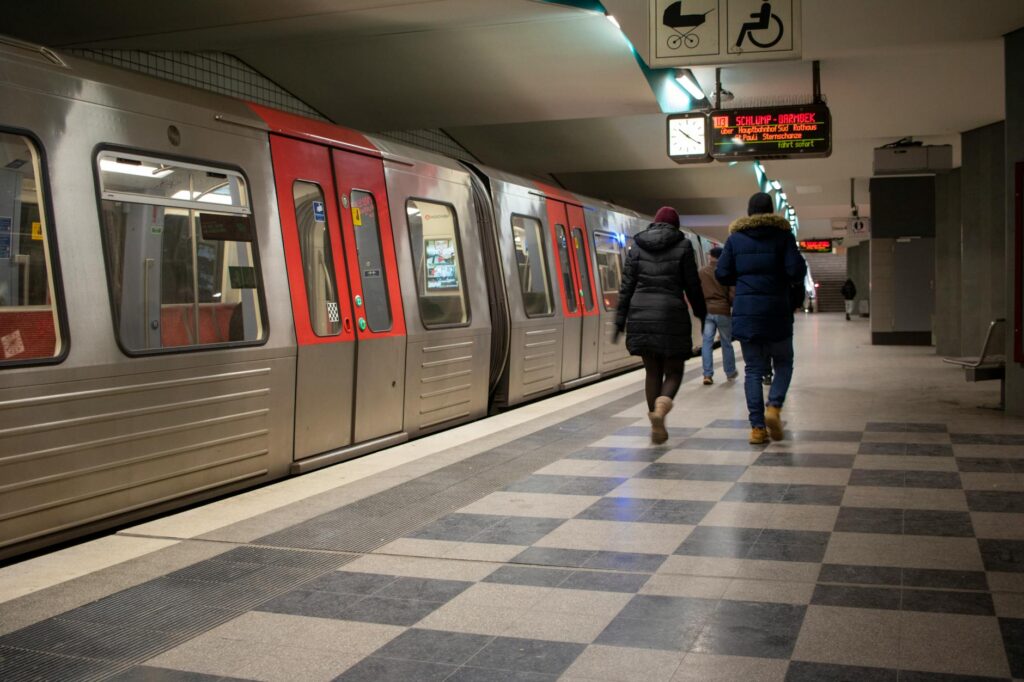 Passengers walking along a subway platform in Hamburg, Germany.